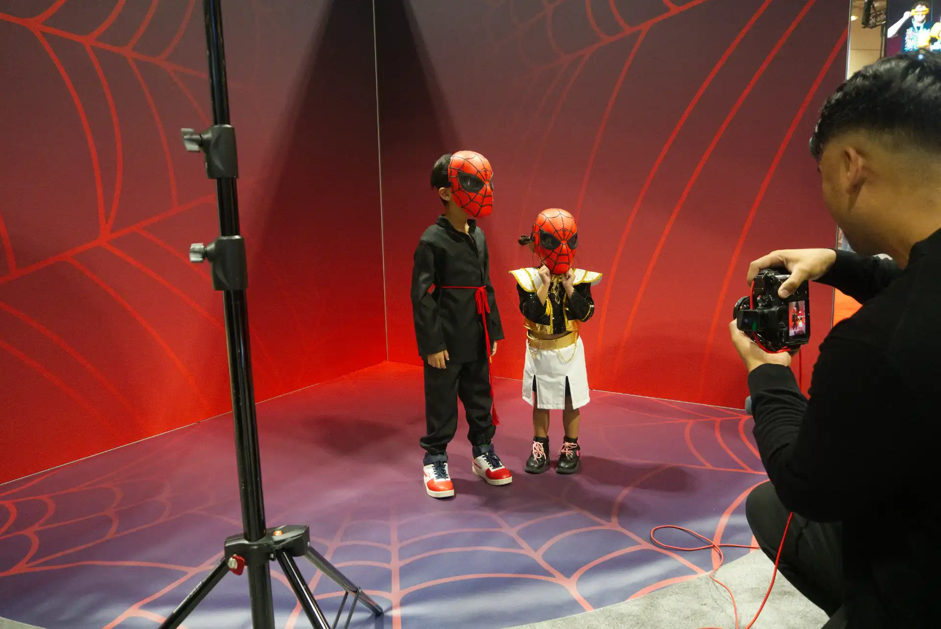 FAN EXPO Canada 2026 - family photo opportunity at Disney Consumer Products booth with Toy Story backdrop