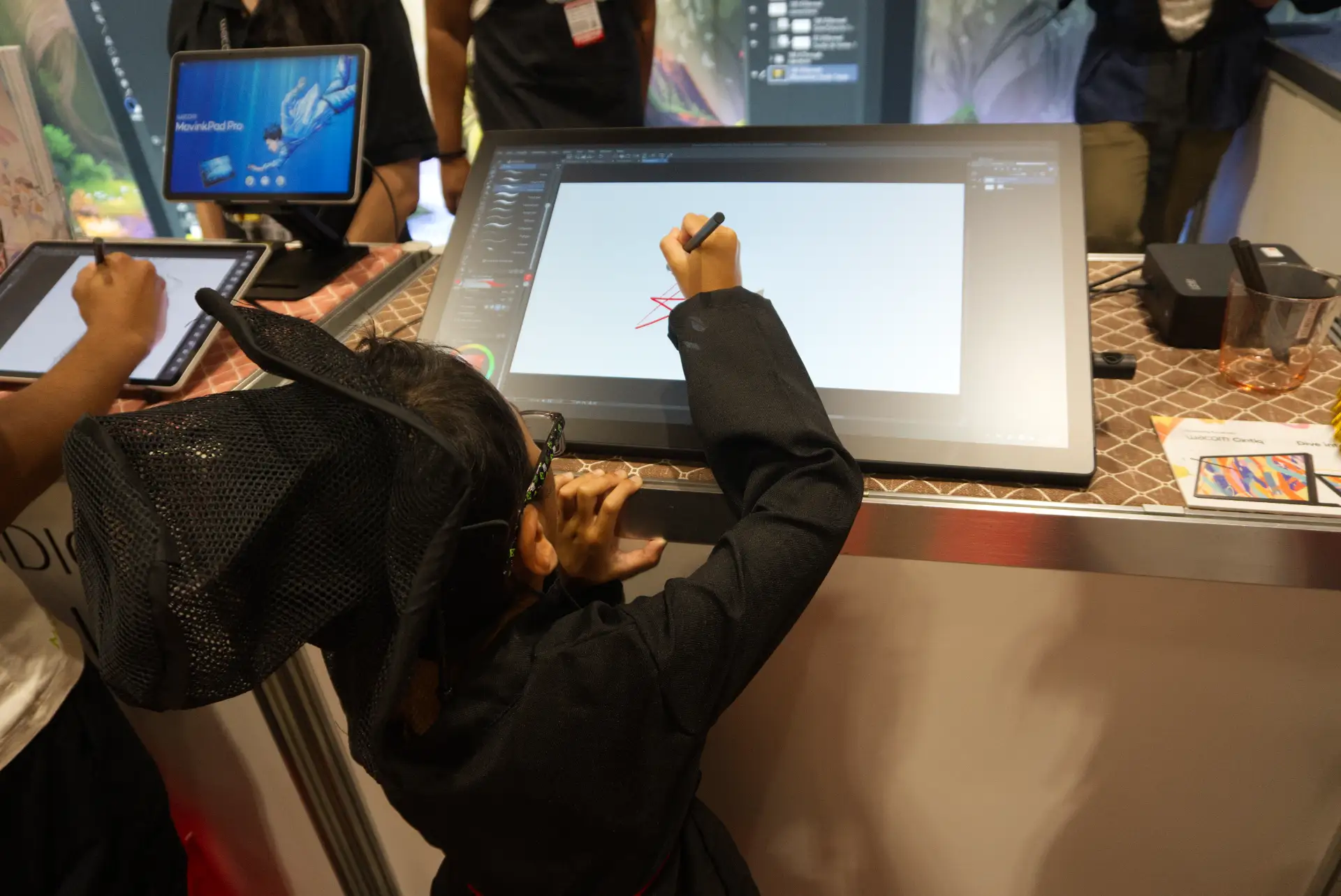 FAN EXPO Canada 2026 - children drawing on Wacom MovinkPad at the Wacom booth