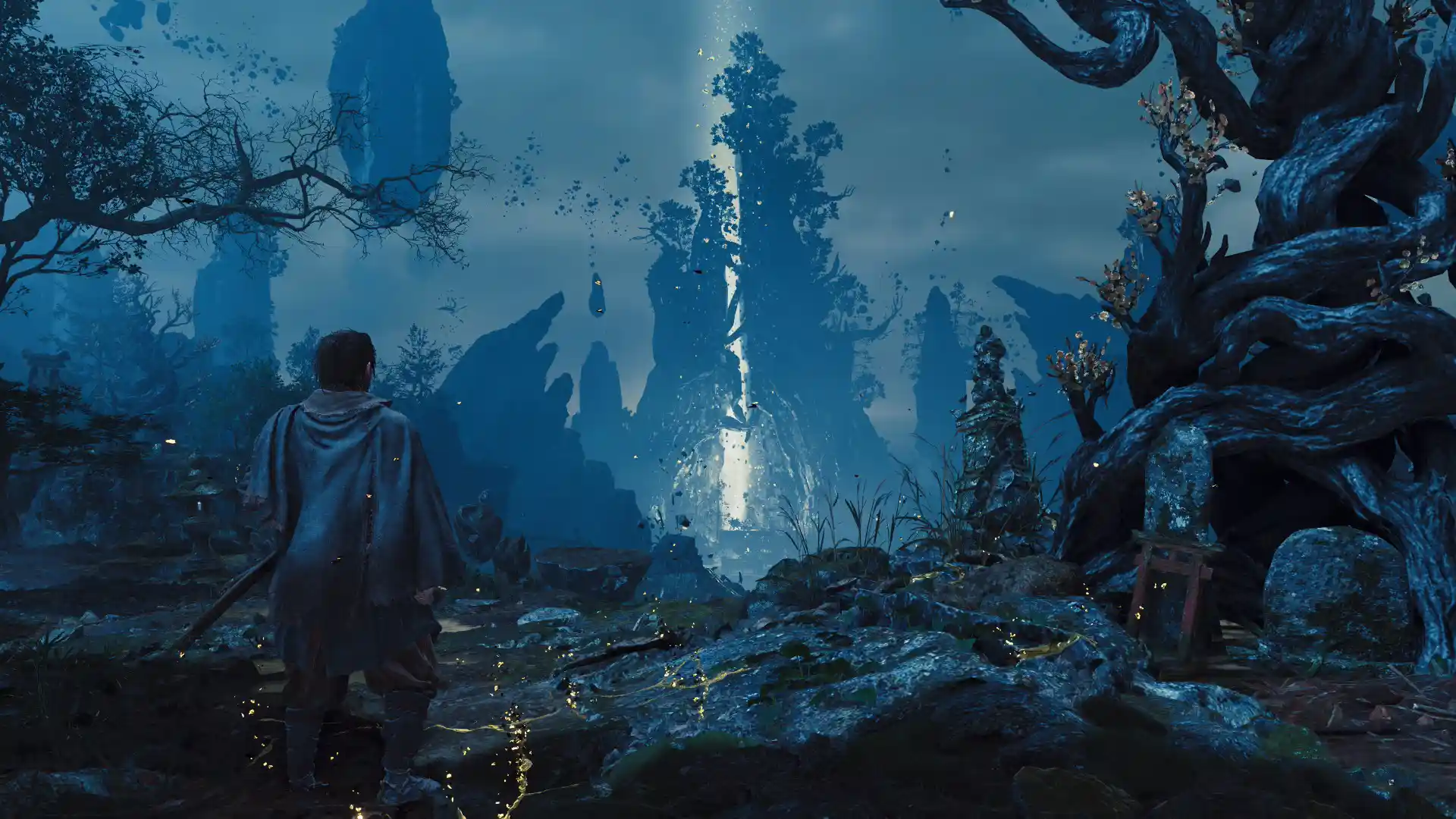 A lone robed figure gazes across a vast blue corrupted landscape of floating rock shards, gnarled trees, and a rising beam of light